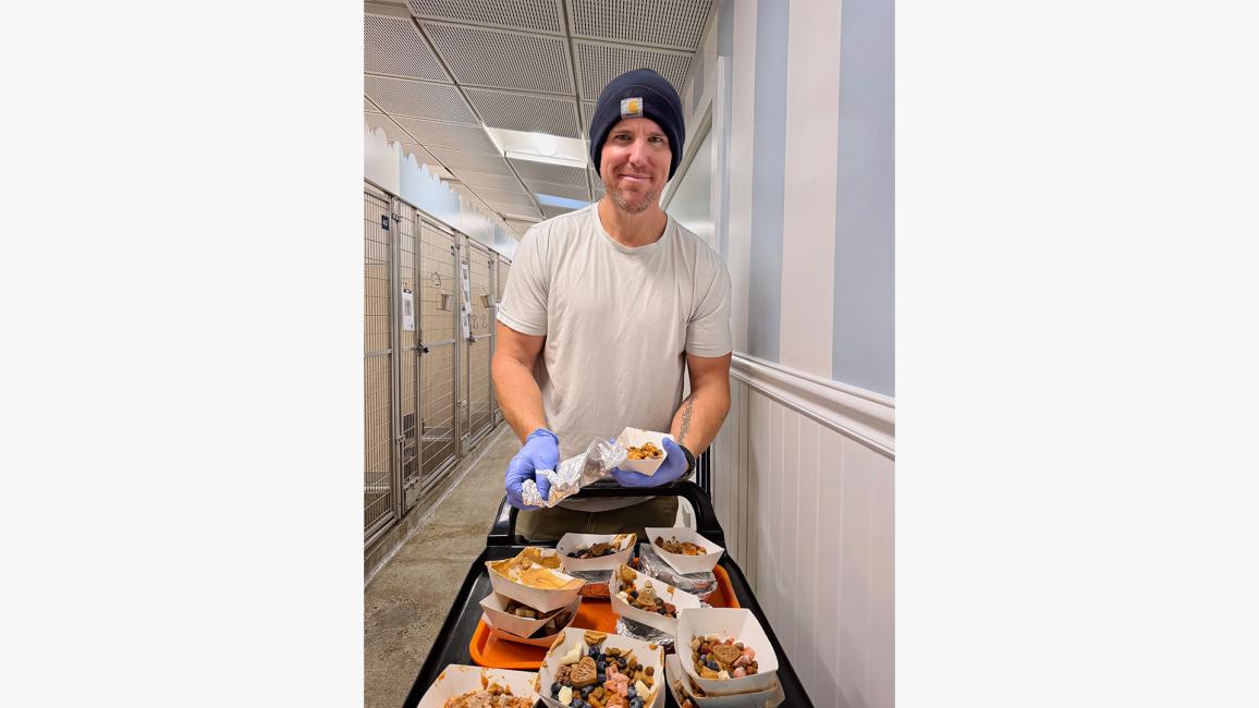 Alex Mestres volunteering by bringing meals to pets at Best Friends in Los Angeles