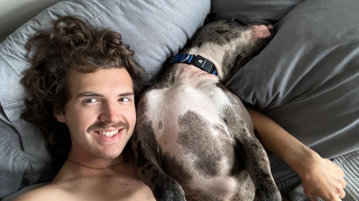 Tanner the man lying next to Tanner the dog